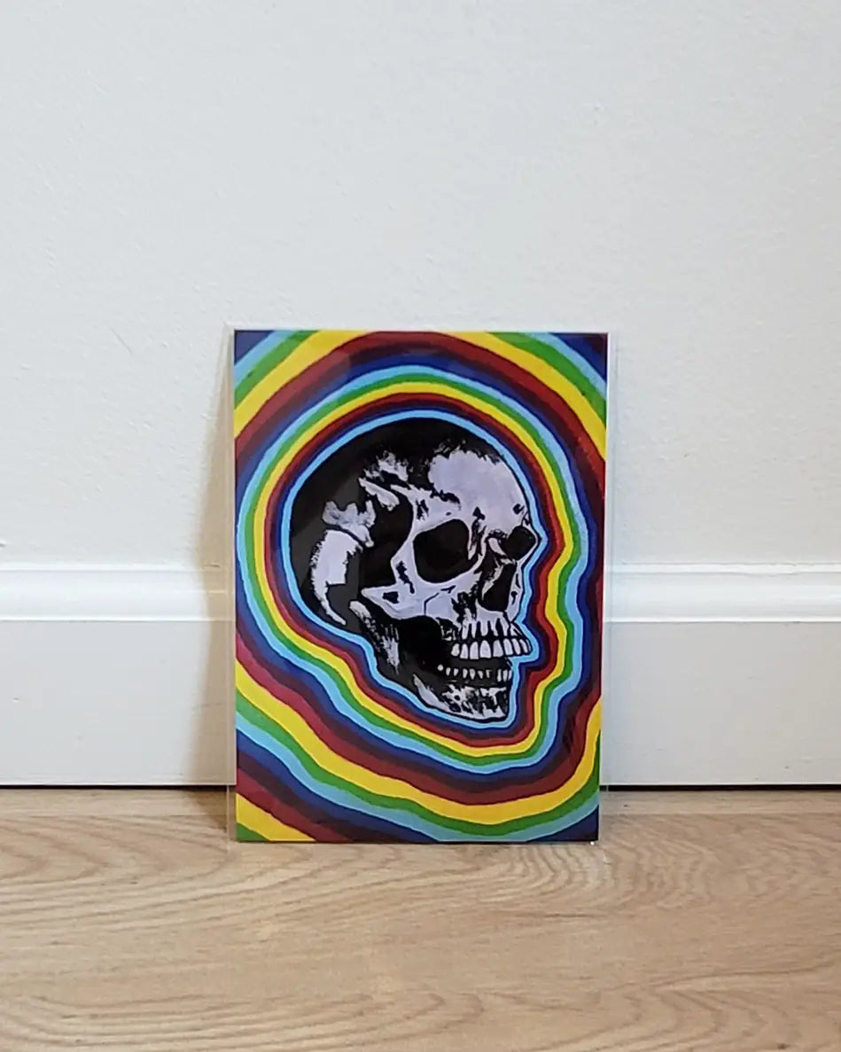 painting of a skull with a rainbow background