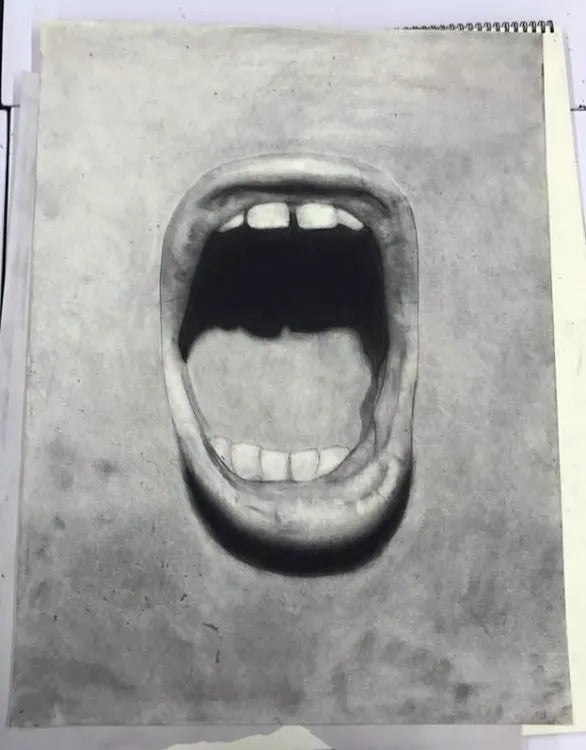 Grey-toned charcoal drawing of an open mouth.