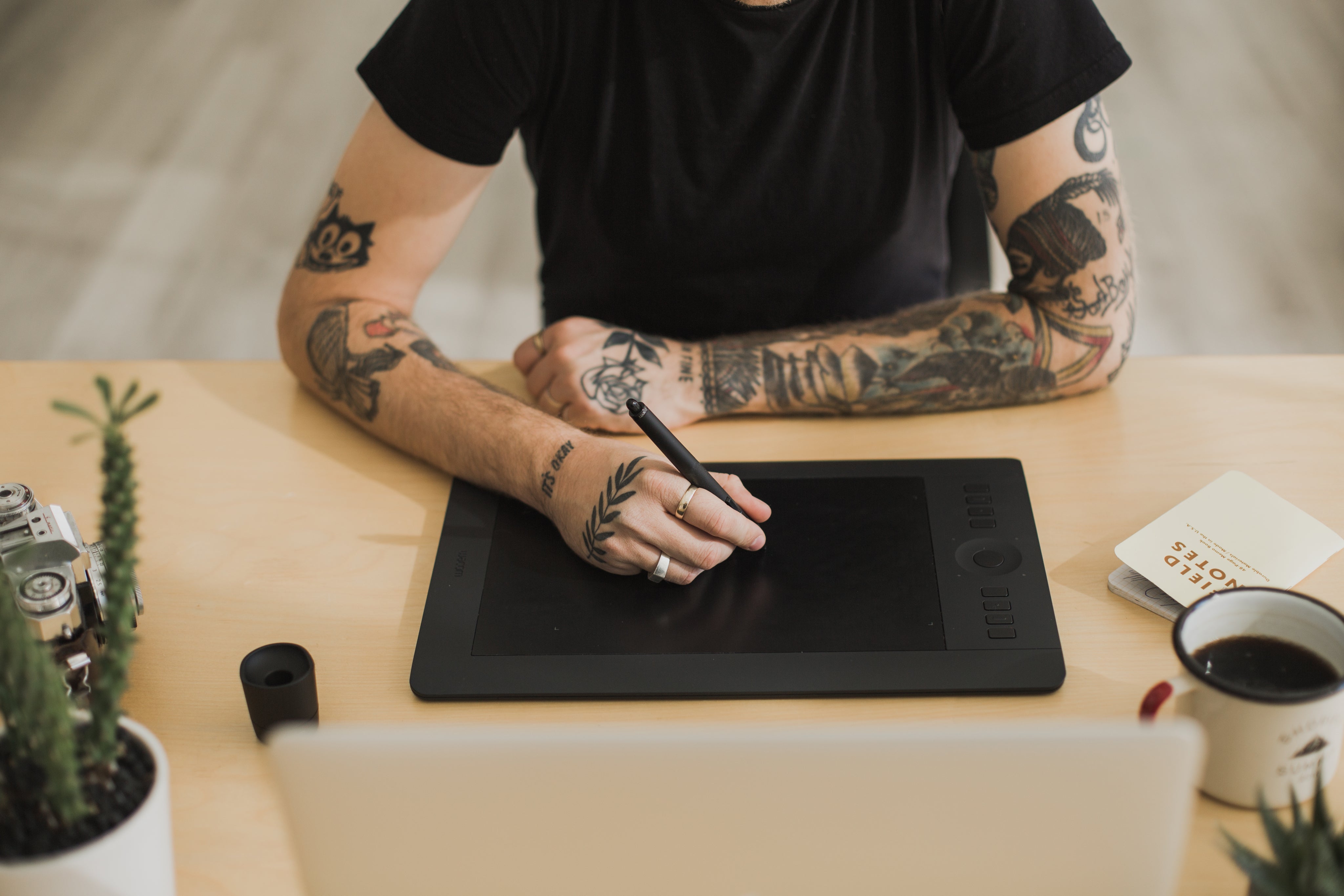 tattood-man-using-creative-technology.jpg